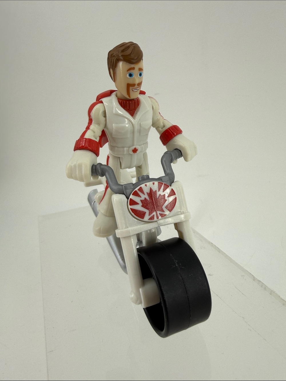 White and Red Action Figure on Toy Motorcycle - Kids Toys